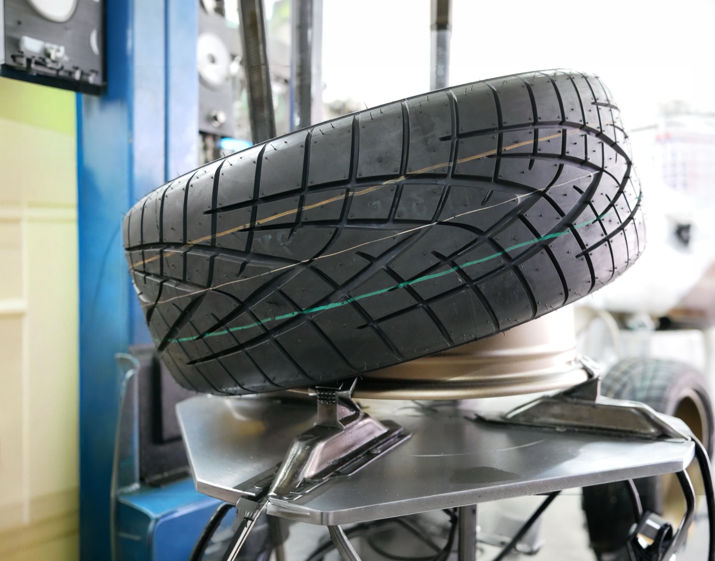 New tyre with fresh tread on a tyre-changer machine